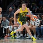 FILE - Seattle Storm forward Breanna Stewart brings the ball up against the Minnesota Lynx during the first half of a WNBA basketball game Wednesday, Aug. 3, 2022, in Seattle. Breanna Stewart became the first player to repeat as The Associated Press WNBA Player of the Year, Tuesday, Aug. 16, 2022. (AP Photo/Ted S. Warren, File)