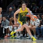 FILE - Seattle Storm forward Breanna Stewart brings the ball up against the Minnesota Lynx during the first half of a WNBA basketball game Wednesday, Aug. 3, 2022, in Seattle. Breanna Stewart became the first player to repeat as The Associated Press WNBA Player of the Year, Tuesday, Aug. 16, 2022. (AP Photo/Ted S. Warren, File)