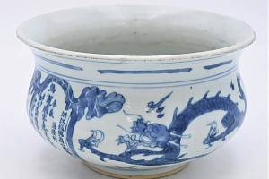 Photo Caption: A zhadou is a bowl for discarding table scraps. This one sold for $7,680 at Nadeau's Auction Gallery.