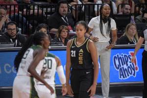 Seattle Storm head coach Noelle Quinn directs her team during the first half of a WNBA basketball game against the Las Vegas Aces, Sunday, Aug. 14, 2022, in Las Vegas. (AP Photo/Sam Morris)