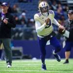 Washington quarterback Michael Penix Jr. carries the ball during a spring scrimmage on April 30 in Seattle. (Cheyenne Boone/The News Tribune via AP)