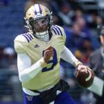 FILE - Washington quarterback Michael Penix Jr. carries the ball during a spring NCAA college football scrimmage, Saturday, April 30, 2022, in Seattle. Washington is set to kick off its season on Sept. 3, 2022, against Kent State. (Cheyenne Boone/The News Tribune via AP, File)