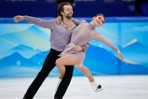Kaitlin Hawayek and Jean-Luc Baker, of the United States, perform their routine in the ice dance competition during the figure skating at the 2022 Winter Olympics, Monday, Feb. 14, 2022, in Beijing. (AP Photo/David J. Phillip)