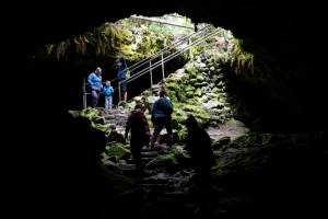 *LEADOPTION* Hikers walk near the entrance of Ape Caves on Friday, July 22, 2022, at in Gifford Pinchot National Forest. The caves were discovered in 1942 and are lava tubes from an eruption of Mt. Saint Helens 2,000 years ago. Temperatures in the caves are 42 degrees year-round.  (Taylor Balkom/The Columbian)