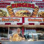 Onions are grilled up at the Walla Walla Burger booth during opening day of the Evergreen State Fair on Thursday, Aug. 25, 2022 in Monroe, Washington. (Olivia Vanni / The Herald)