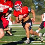 Stanwoods Ryder Bumgarner runs the ball during football practice on Monday, Aug. 29, 2022 in Stanwood, Washington. (Olivia Vanni / The Herald)