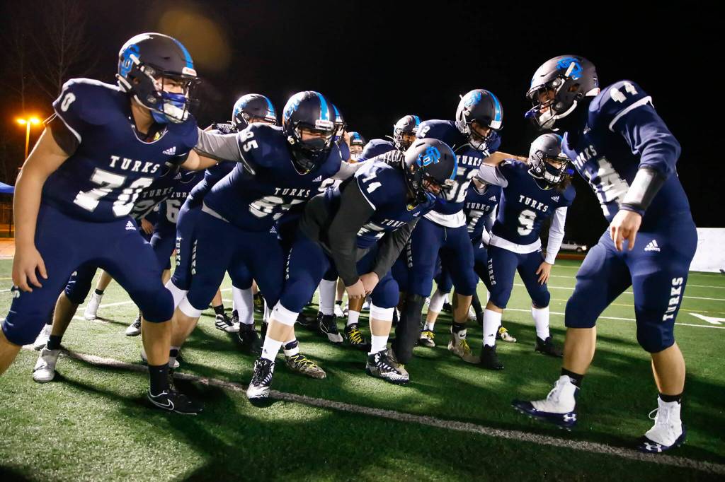 The Sultan Turks rally before their game against the Granite Falls Tigers in Sultan on Feb. 26, 2021. (Kevin Clark / The Herald)