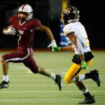 Cascades Zach Lopez, left, rushes with Mariners Macky James closing in on Sept. 10, 2021, at Everett Memorial Stadium. (Kevin Clark / The Herald)