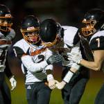 Granite Falls' Riley Hoople celebrates his touchdown with his teammates during the game against South Whidbey on Friday, Oct. 29, 2021 in Langley, Wa. (Olivia Vanni / The Herald)