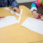 Kindergarteners do a paper cutting exercise on Aug. 26, near Everett. (Olivia Vanni / The Herald)
