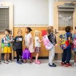 Kindergarteners from around the school district wait to change classrooms at Woodside Elementary School during Everett Ready, a program that helps kindergarteners get familiar with school routines on Friday, Aug. 26, 2022, near Everett, Washington. (Olivia Vanni / The Herald)