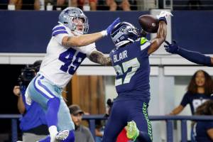 Seattle Seahawks safety Marquise Blair (27) breaks up a pass intended for Dallas Cowboys tight end Peyton Hendershot (49) in the end zone in the first half of a preseason NFL football game in Arlington, Texas, Friday, Aug. 26, 2022. (AP Photo/Michael Ainsworth)