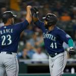 Seattle Mariners' Carlos Santana (41) celebrates his two-run home run with Ty France (23) in the fifth inning of a baseball game against the Detroit Tigers in Detroit, Tuesday, Aug. 30, 2022. (AP Photo/Paul Sancya)
