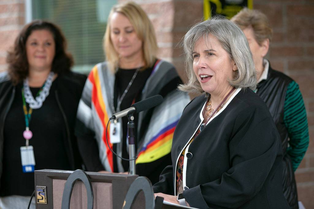 Dr. Rebecca Miner, Interim Superintendent of Edmonds School District, addresses a small crowd to kick off an opening ceremony of a new school health center at Meadowdale High School on Wednesday, in Lynnwood. (Ryan Berry / The Herald)