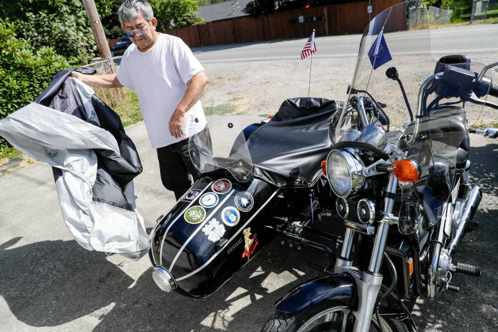 Walt Jackson, a Granite Falls veteran, has attached a sidecar to his Honda Shadow which allows his wife, who suffered a stroke, to ride along. Photographed Aug. 16, in Granite Falls. (Kevin Clark / The Herald)