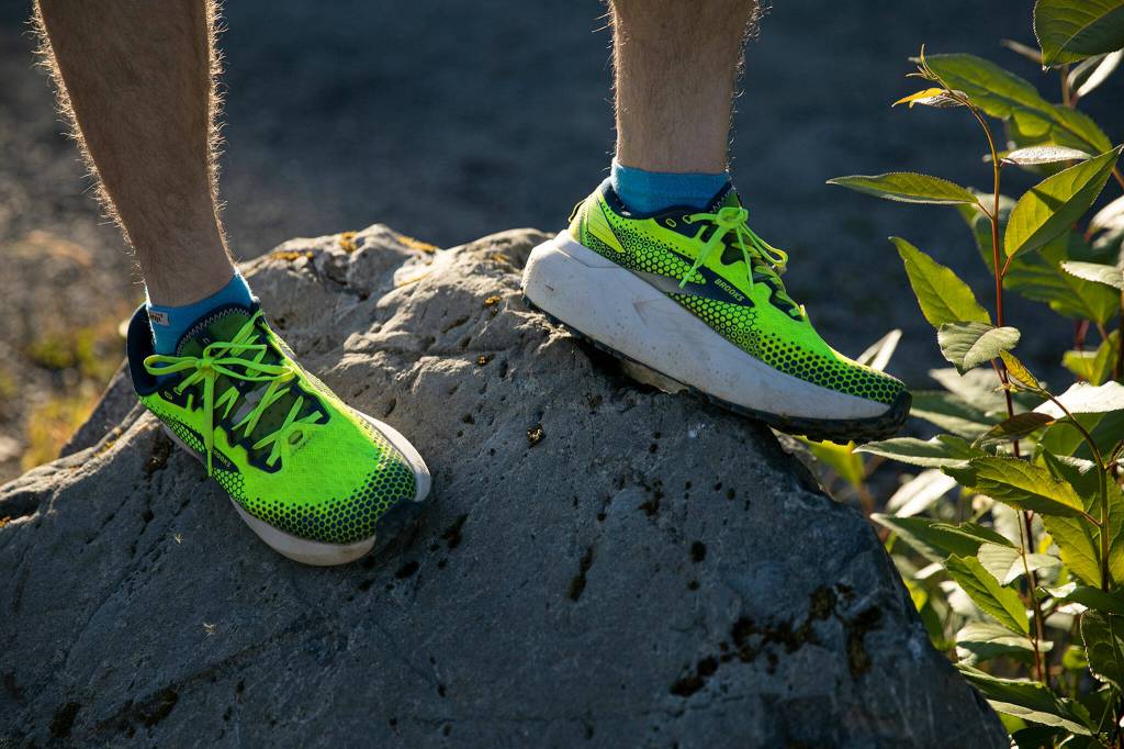 Greg Nance wears his Brooks running shoes on Tuesday, at the Mount Pilchuck Trailhead near Verlot. Brooks is one of the sponsors Nance has teamed up with during his running career. (Ryan Berry / The Herald)