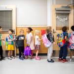 Kindergarteners from around the school district wait to change classrooms at Woodside Elementary School during Everett Ready, a program that helps kindergarteners get familiar with school routines on Aug. 26, near Everett. (Olivia Vanni / The Herald)