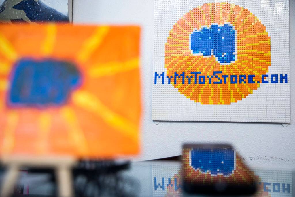 A lego mosaic of the MyMyToyStore.com logo hangs on the wall on Sept. 6, in Everett. (Olivia Vanni / The Herald)
