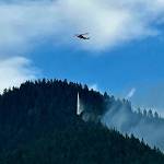 A helicopter drops water on one of three wildfires burning east of Darrington. (Mt. Baker-Snoqualmie National Forest - US Forest Service)