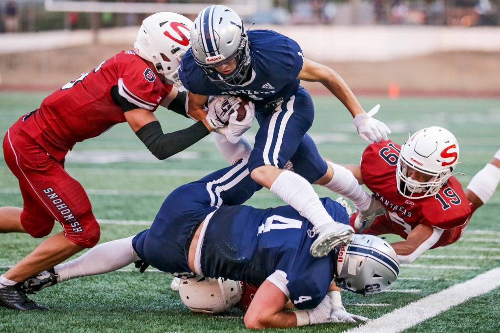 Glacier Peaks Gabe Russel is forced out of bound by Snohomishs Parker Jackson Friday night at Snohomish High School in Snohomish, Washington on September 2, 2022. Glacier Peak led 28-0 at the half. (Kevin Clark / The Herald)