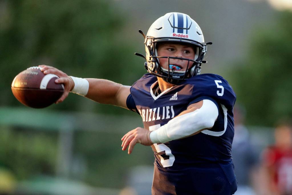 Glacier Peaks River Lien draws back to pass against Snohomish Friday night at Snohomish High School in Snohomish, Washington on September 2, 2022. Glacier Peak led 28-0 at the half. (Kevin Clark / The Herald)