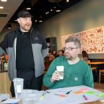 Tom Bosserman, left to right, Cornelius Ersoz and Nick Watkin on Monday morning during a sip in at Starbucks for union solidarity in Everett. (Kevin Clark / The Herald)