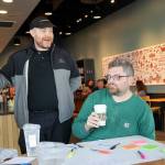 Tom Bosserman, left to right, Cornelius Ersoz and Nick Watkin Monday morning during a “sip in” at Starbucks for union solidarity in Everett, Washington on August 5, 2022.  (Kevin Clark / The Herald)