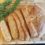 This loaf of rosemary bread was over-proofed, due to a warm kitchen, but luckily was still delicious with a dinner of roast beef, carrots and potatoes. (Photo by Tressa Dale)