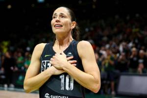 Seattle Storm guard Sue Bird reacts to fans chanting "Thank you Sue" after the Storm were eliminated from the playoffs with a loss in Game 4 of a WNBA basketball playoff semifinal to the Las Vegas Aces, Tuesday, Sept. 6, 2022, in Seattle. (AP Photo/Lindsey Wasson)