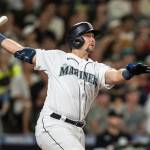 Seattle Mariners' Cal Raleigh watches his two-run home run off Chicago White Sox relief pitcher Reynaldo Lopez during the eighth inning of a baseball game Tuesday, Sept. 6, 2022, in Seattle. (AP Photo/Stephen Brashear)