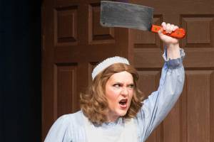Helsa_cleaver.jpg: Helsa Wenzel (Melissa Dowell) is a maid with a secret… and a deadly weapon in Red Curtain’s production of “Musical Comedy Murders of 1940,” running Sept. 9-25 in Marysville.