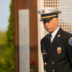 Former New York firefighter Andy Speier speaks to a crowd during a ceremony to commemorate the 21st anniversary of the September 11 terrorist attacks on the U.S. on Sep. 11, 2022, outside South County Fire Station 17 in downtown Edmonds, Washington. (Ryan Berry / The Herald)
