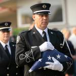 The colors are presented during a ceremony to commemorate the 21st anniversary of the September 11 terrorist attacks on the U.S. on Sep. 11, 2022, outside South County Fire Station 17 in downtown Edmonds, Washington. (Ryan Berry / The Herald)