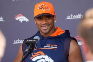 Denver Broncos quarterback Russell Wilson responds to a question during a news conference before the NFL football team's practice Thursday, Sept. 8, 2022, at the Broncos' headquarters in Centennial, Colo. The Broncos open the NFL season Monday night against the Seahawks in Seattle. (AP Photo/David Zalubowski)