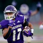 Limar bursts down the sideline for one of his three touchdowns. (Ryan Berry / The Herald)