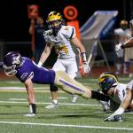 Lake Stevens receiver Cole Becker reaches across the goal line for a third-quarter touchdown. (Ryan Berry / The Herald)