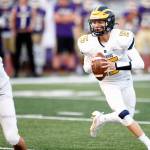 Bellevues Lucas Razore turns and looks for a receiver against Lake Stevens on Friday, Sep. 9, 2022, at Lake Stevens High School in Lake Stevens, Washington. (Ryan Berry / The Herald)