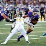 Lake Stevens Jayden Limar takes a carry right at the defense against Bellevue on Friday, Sep. 9, 2022, at Lake Stevens High School in Lake Stevens, Washington. (Ryan Berry / The Herald)