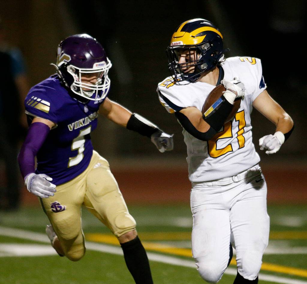 Bellevues Joel Schneider tries to evade a defender on a kick return against Lake Stevens on Friday, Sep. 9, 2022, at Lake Stevens High School in Lake Stevens, Washington. (Ryan Berry / The Herald)