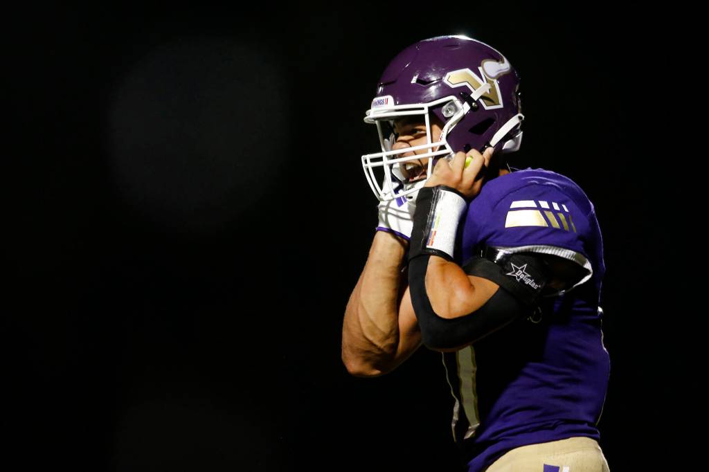 Lake Stevens Jayden Limar heads back to his sideline while shouting after punching in the game-sealing touchdown run against Bellevue on Friday, Sep. 9, 2022, at Lake Stevens High School in Lake Stevens, Washington. (Ryan Berry / The Herald)