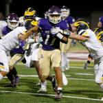 Lake Stevens Jayden Limar muscles through the defense against Bellevue on Friday, Sep. 9, 2022, at Lake Stevens High School in Lake Stevens, Washington. (Ryan Berry / The Herald)