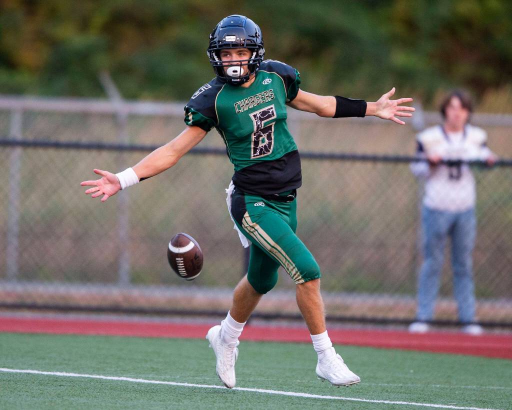Marysville Getchells Carter Schmidt celebrates after getting a touchdown during the game against Arlington on Friday, Sept. 9, 2022 in Marysville, Washington. (Olivia Vanni / The Herald)
