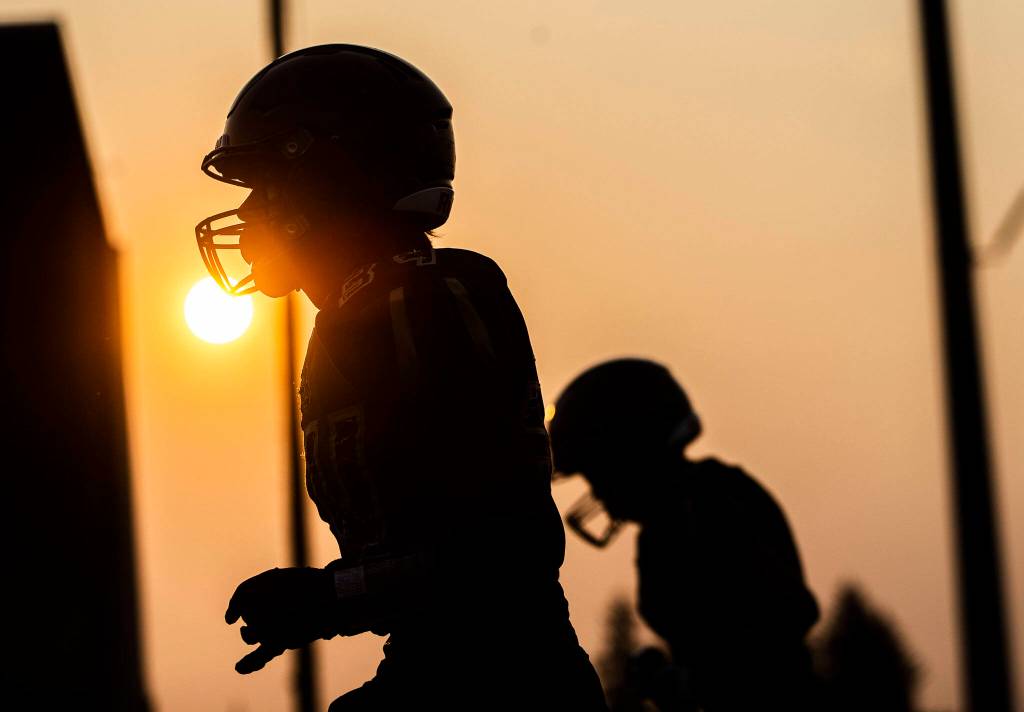 Marysville Getchell players warmup before the game against Arlington on Friday, Sept. 9, 2022 in Marysville, Washington. (Olivia Vanni / The Herald)