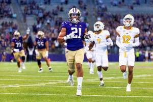 Washington running back Wayne Taulapapa heads for a touchdown against Kent State during the first quarter of an NCAA college football game Saturday, Sept. 3, 2022, in Seattle. (Dean Rutz/The Seattle Times via AP)