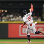 Atlanta Braves' Michael Harris II gestures as he runs the bases after hitting a solo home run during the sixth inning of the team's baseball game against the Seattle Mariners, Friday, Sept. 9, 2022, in Seattle. (AP Photo/Caean Couto)