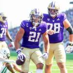 Washington running back Wayne Taulapapa (21) celebrates a touchdown during a game against Portland State on Saturday afternoon in Seattle. (Scott Eklund/Red Box Pictures)