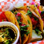 The queso birria tacos at El Mariachi call for slow cooked brisket, melty cheese sandwiched between two corn tortillas, a shower of cilantro and bright pink pickled onions, and a bowl of consomé. Thursday, Sept. 8, 2022. (Taylor Goebel / The Herald)