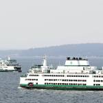 Ferries cross path in the waters of Possession Sound through the smoke and haze of the Darrington wildfires in Mukilteo, Washington on September 9, 2022. (Kevin Clark / The Herald)