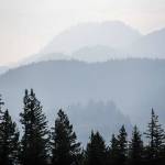 Smoke from the Bolt Creek fire silhouettes mountain ridge and tree layers just outside of Index on Monday, Sept. 12, 2022. (Olivia Vanni / The Herald)