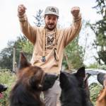 Joe Taylor, co-owner of Pinnacle German Shepards, gets his dogs to sit outside of their new temporary home at Rosecrest Equestrian Estate on Tuesday, in Monroe. (Olivia Vanni / The Herald)
